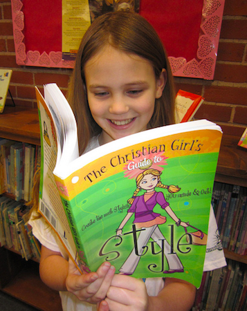 Tween girl reading The Christian Girl's Guide to Style by Sherry Kyle